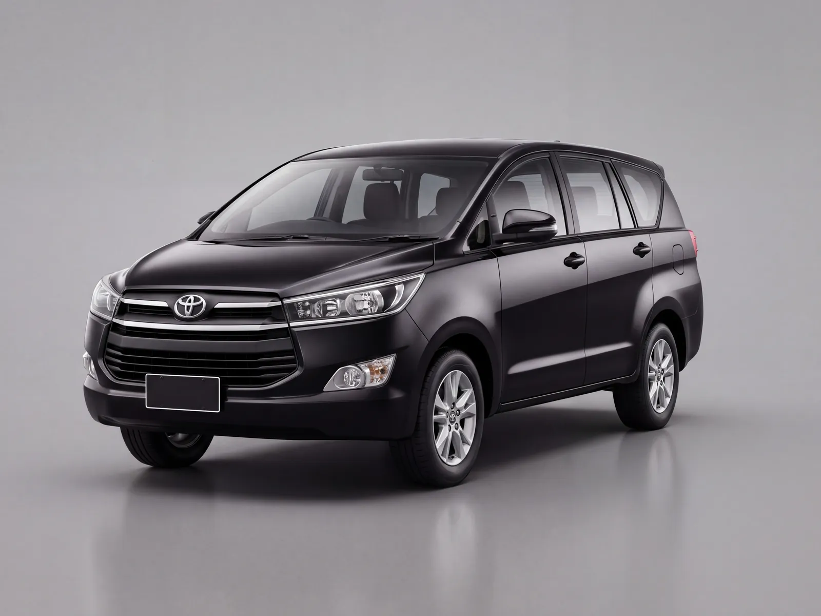 A black Toyota Innova 7-seater self-drive rental car