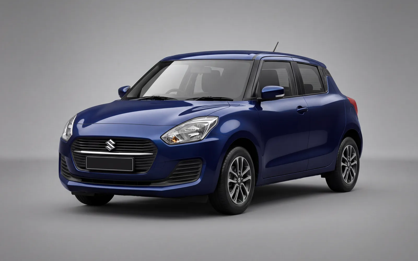 A navy blue Maruti Suzuki Swift hatchback self-drive rental car