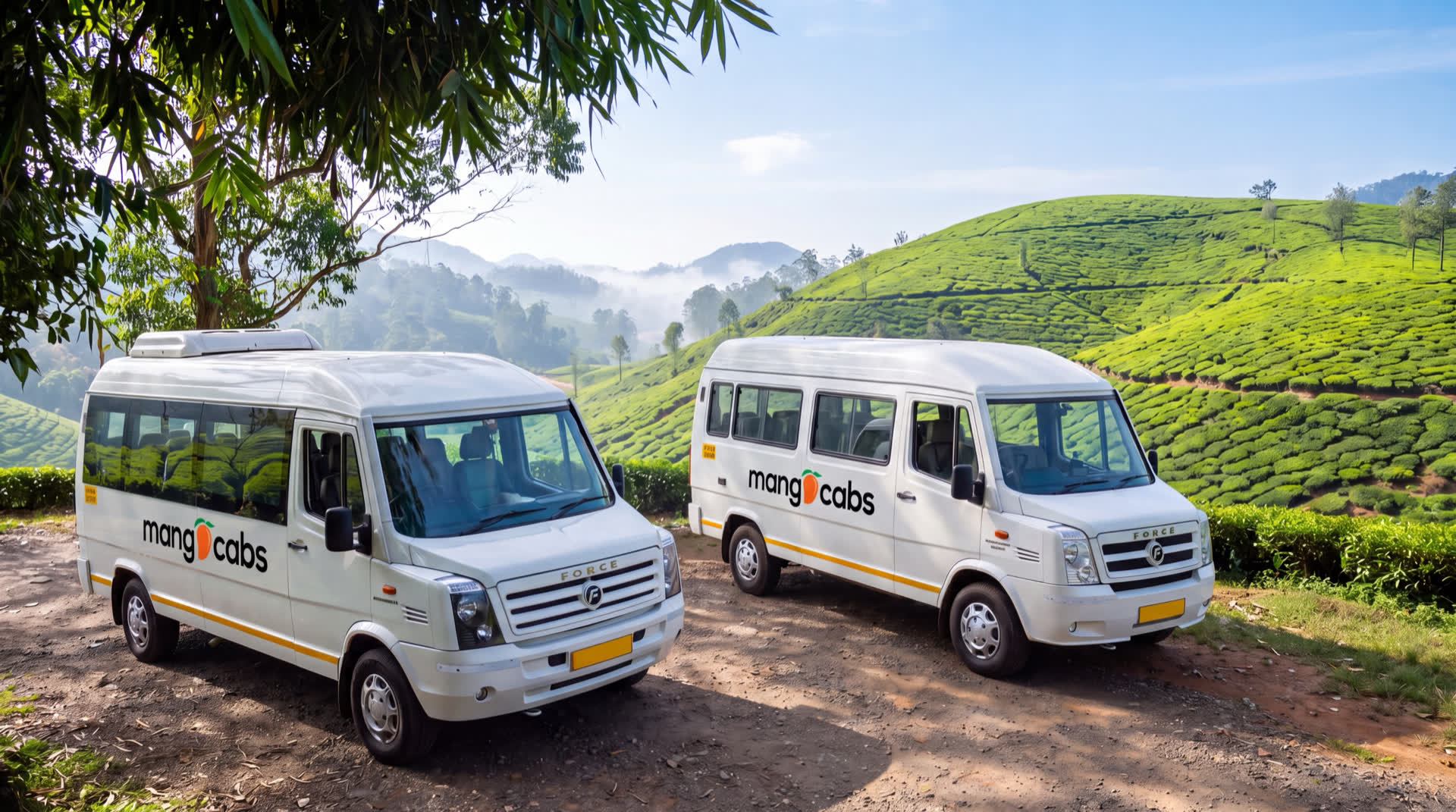 Two Mango Cabs Tempo Travellers parked on a hill track above the Munnar tea gardens